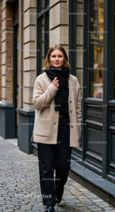 Fashionable Woman in Cozy Coat and Black Pants Walking in City
