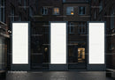 Three Large Illuminated Blank Billboards in Urban Alley