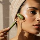 Close-Up of a Woman Using Jade Roller for Facial Massage with Natural Glow