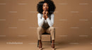 Elegant Woman Sitting on Chair in Stylish Indoor Setting