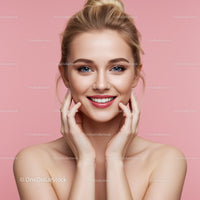 Beautiful Woman with Bright Smile and Clear Skin on Pink Background