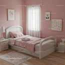 Cozy Pink Children's Bedroom with Pastel Decor and Floral Art