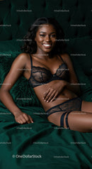 Smiling woman relaxing in elegant black lace lingerie