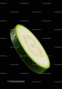 Close up of fresh sliced zucchini with water drops