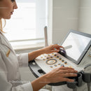 Healthcare Professional Using Ultrasound Machine in Modern Medical Clinic