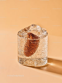 Refreshing close-up of soda with ice cube and bread