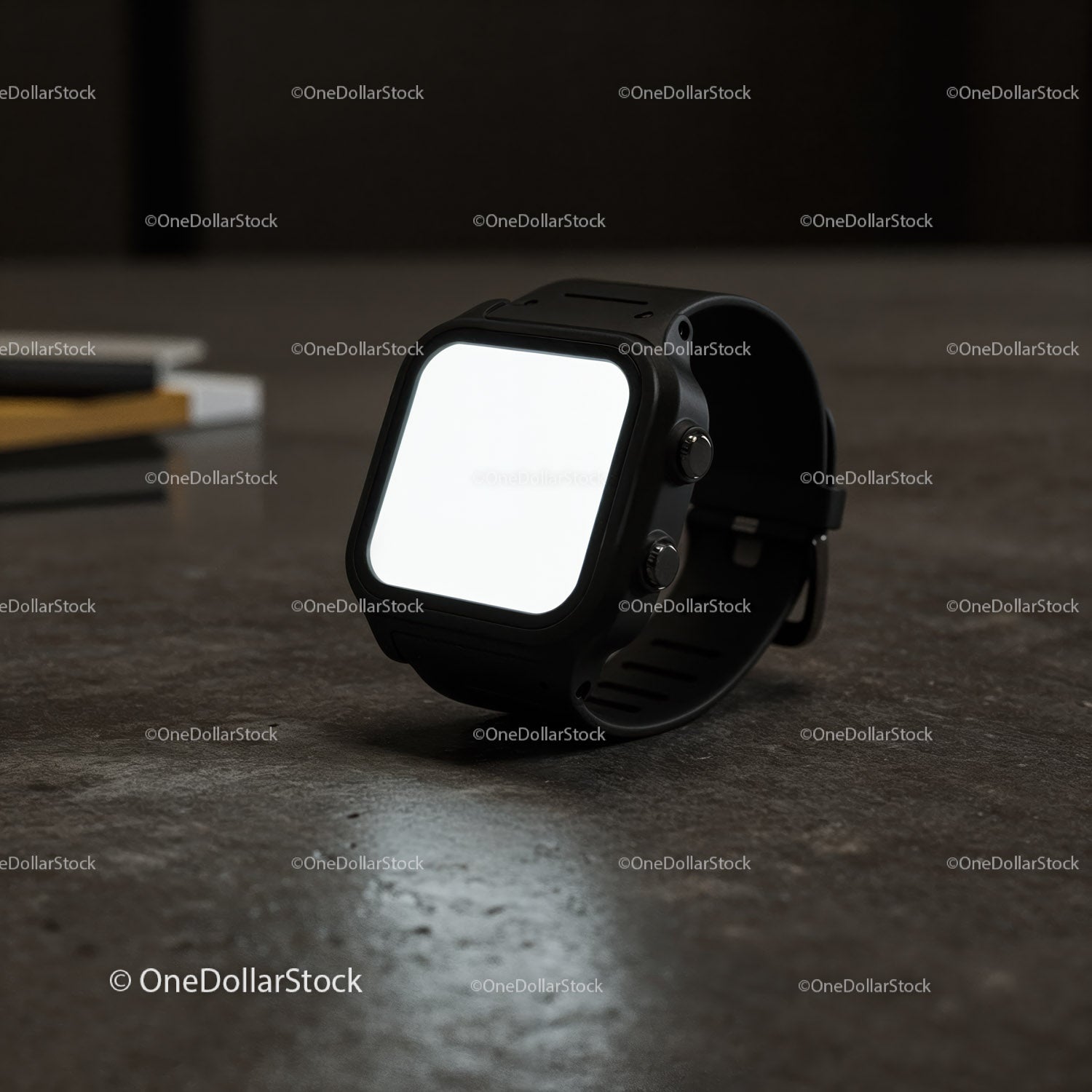 Nowoczesny czarny smartwatch spoczywający na teksturowanej powierzchni