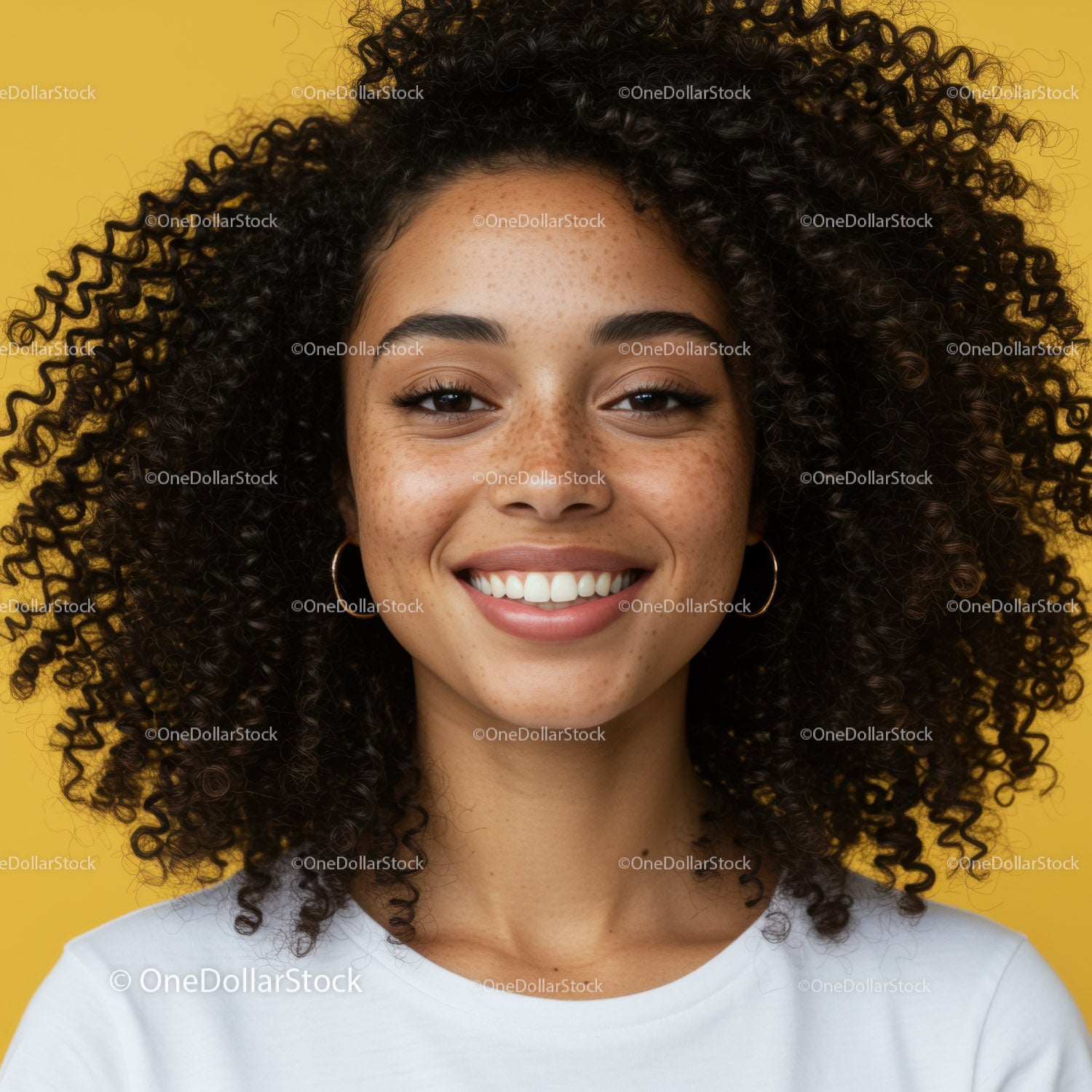 Close-up Portrait of Smiling Woman with Curly Hair Against Yellow Background