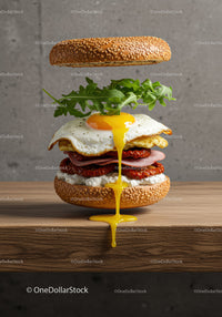 Open sesame bagel with egg and fresh arugula layers