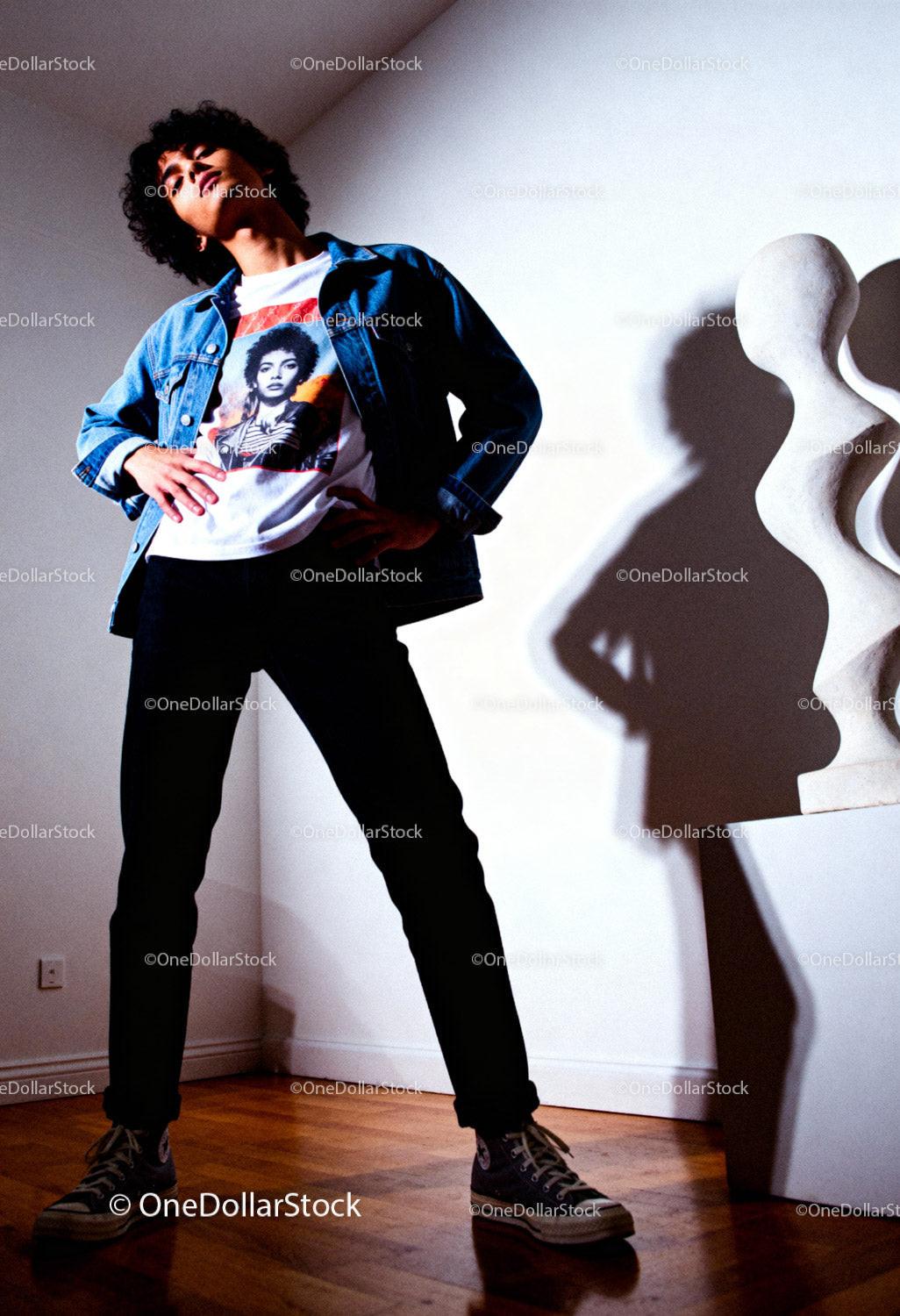 Confident young man posing in a modern art space