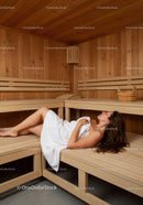 Relaxing Woman Lying on Wooden Sauna Bench in Wellness Center
