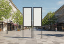 Empty dual billboard in vibrant urban pedestrian street