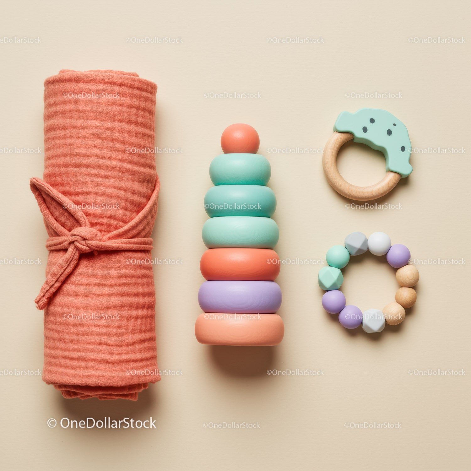 Minimalist baby toys and swaddle blanket arrangement