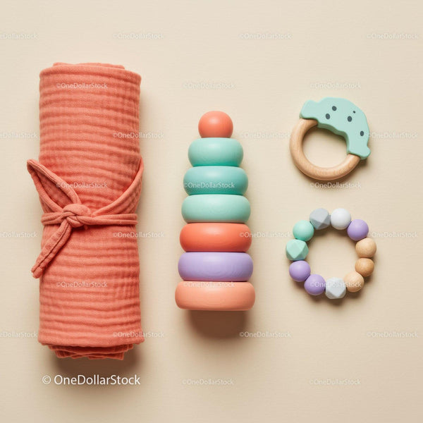 Minimalist baby toys and swaddle blanket arrangement