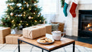 Cozy Christmas scene with gifts and hot cocoa by fireplace