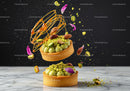 Pistachio tartlets with nuts and caramel decoration