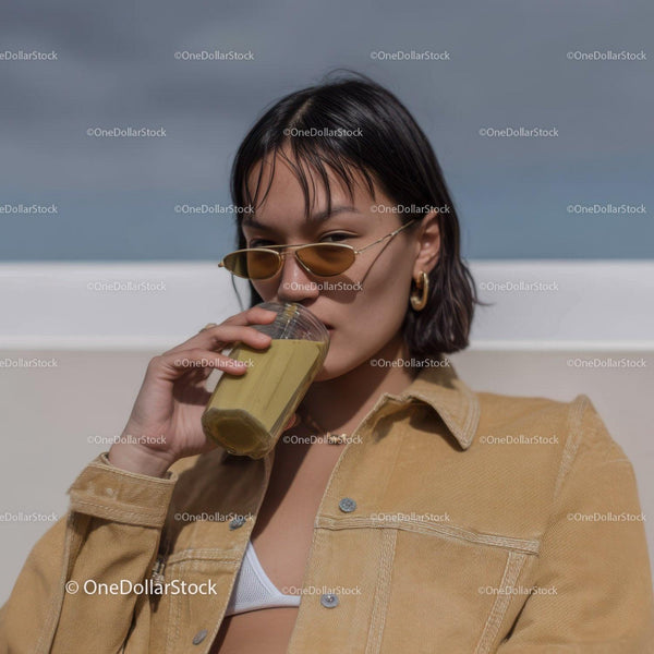 Young Woman Drinking Juice Wearing Sunglasses Outdoors Casual Fashion