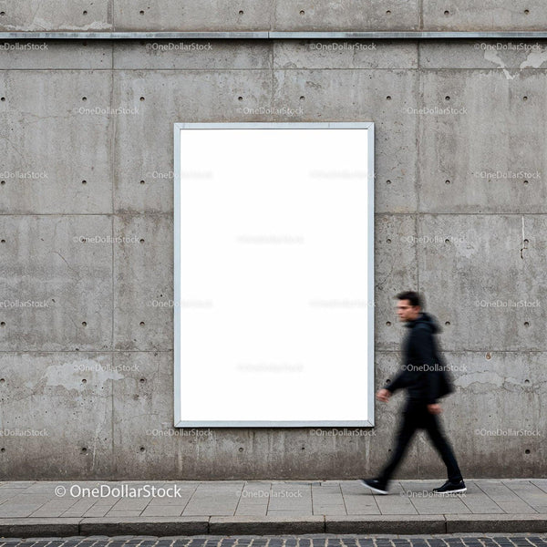 Blurred man walking past blank urban billboard on concrete wall JPG Mockup Image