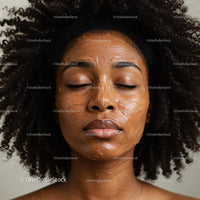 Woman with Facial Mud Mask Relaxing Skincare Treatment