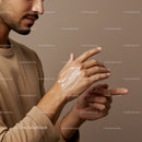 Close-up of Man Applying Lotion on Hand for Skin Care