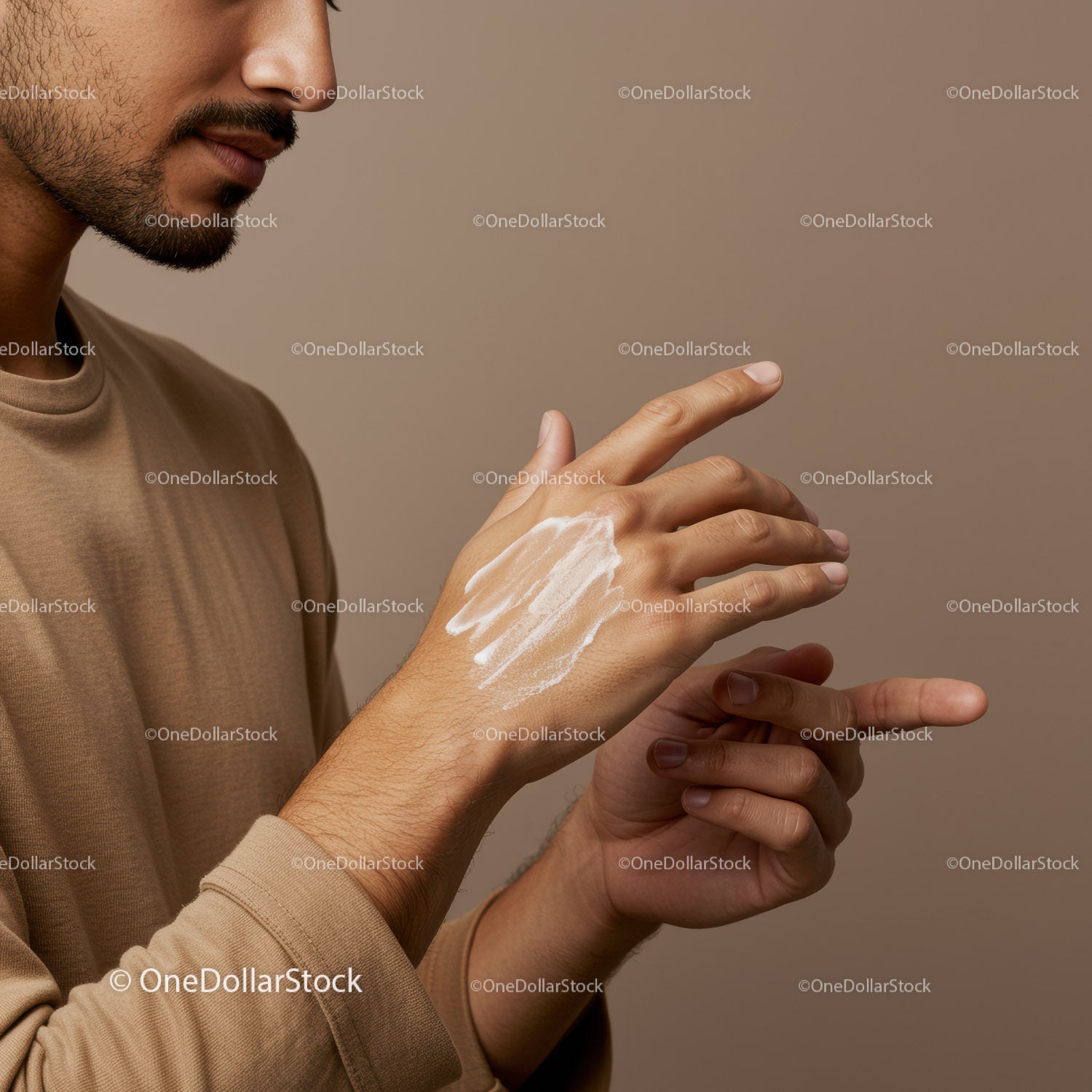 Close-up of Man Applying Lotion on Hand for Skin Care