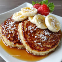 Banana and Strawberry Topped Pancakes with Maple Syrup and Fresh Fruit
