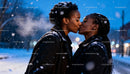 Couple Sharing Tender Kiss in Snowy Winter Evening