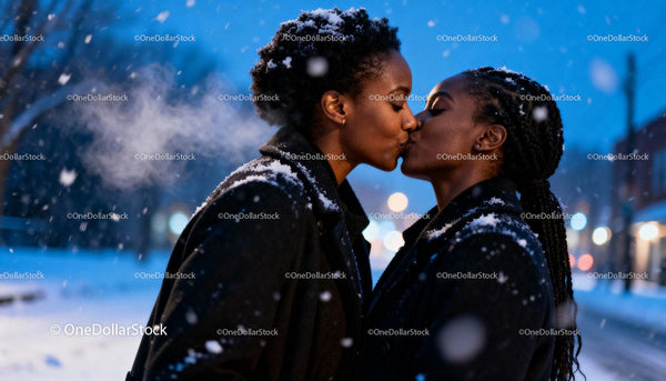 Couple Sharing Tender Kiss in Snowy Winter Evening