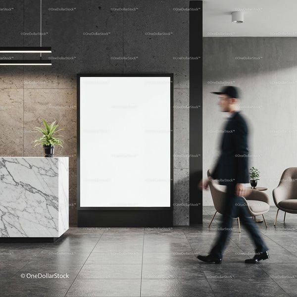 Blurred man walking past blank poster in modern lobby JPG Mockup Image