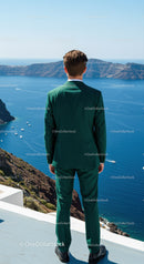 Man in Green Suit Overlooking Calm Blue Sea and Cliffs