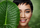 Close-Up of Woman with Tropical Leaf and Water Droplets for Natural Beauty