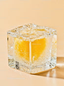 Close up of frozen lemon inside ice cube