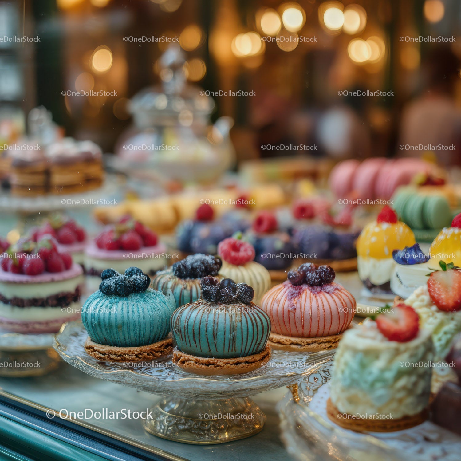 Colorful Mini Cakes and Pastries on Elegant Pastry Display