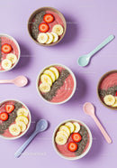Fresh Fruit Smoothie Bowls with Chia Seeds on Purple