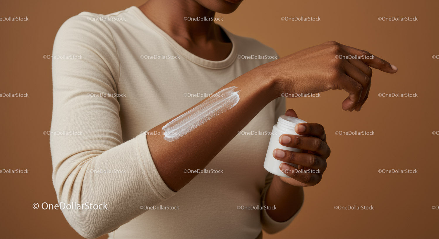 Close-up of Woman Applying Sunscreen Lotion on Arm for Skin Protection