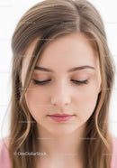 Close-up Portrait of Young Woman with Smooth Skin and Light Brown Hair