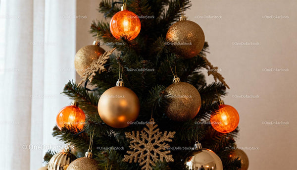 Christmas tree decorated with gold and orange baubles