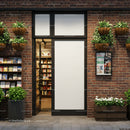 Cozy bookstore entrance with hanging plants and brick wall