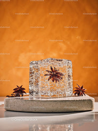Star Anise Frozen Inside Clear Ice Cube on Stone Plate