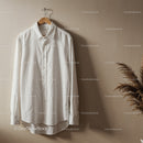 Crisp White Shirt Hanging on Wooden Hanger