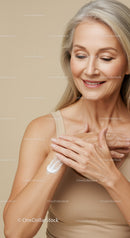 Elegant Mature Woman Applying Lotion for Skin Care and Wellness