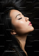 Profile of peaceful woman with flowing black hair