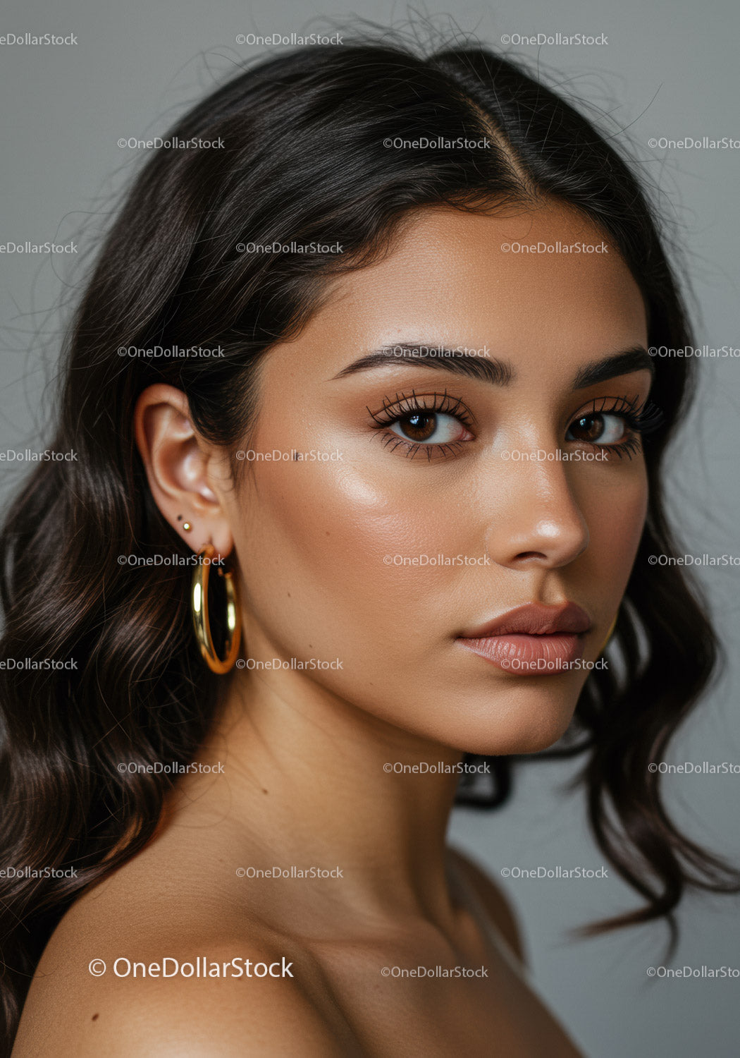Portrait of a Beautiful Woman with Shiny Brown Hair and Gold Earrings