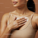 Close-up of Woman Applying Cream on Chest with Soft Skin in Neutral Tones