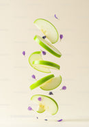 Floating green apple slices with delicate purple flowers