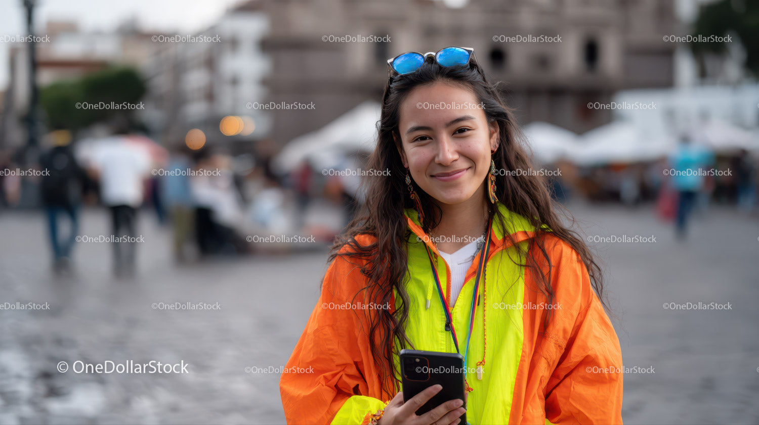 Young Woman Smiling with Smartphone in Vibrant Street Scene