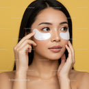 Young Woman Applying Eye Patches for Skincare Treatment