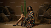 Elegant Model in Brown Suit Posing Amidst Desert Rocks