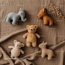 Soft Plush Animal Toys Arranged on Cozy Brown Blanket