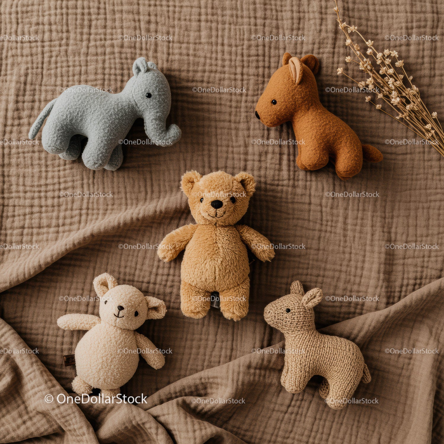 Soft Plush Animal Toys Arranged on Cozy Brown Blanket